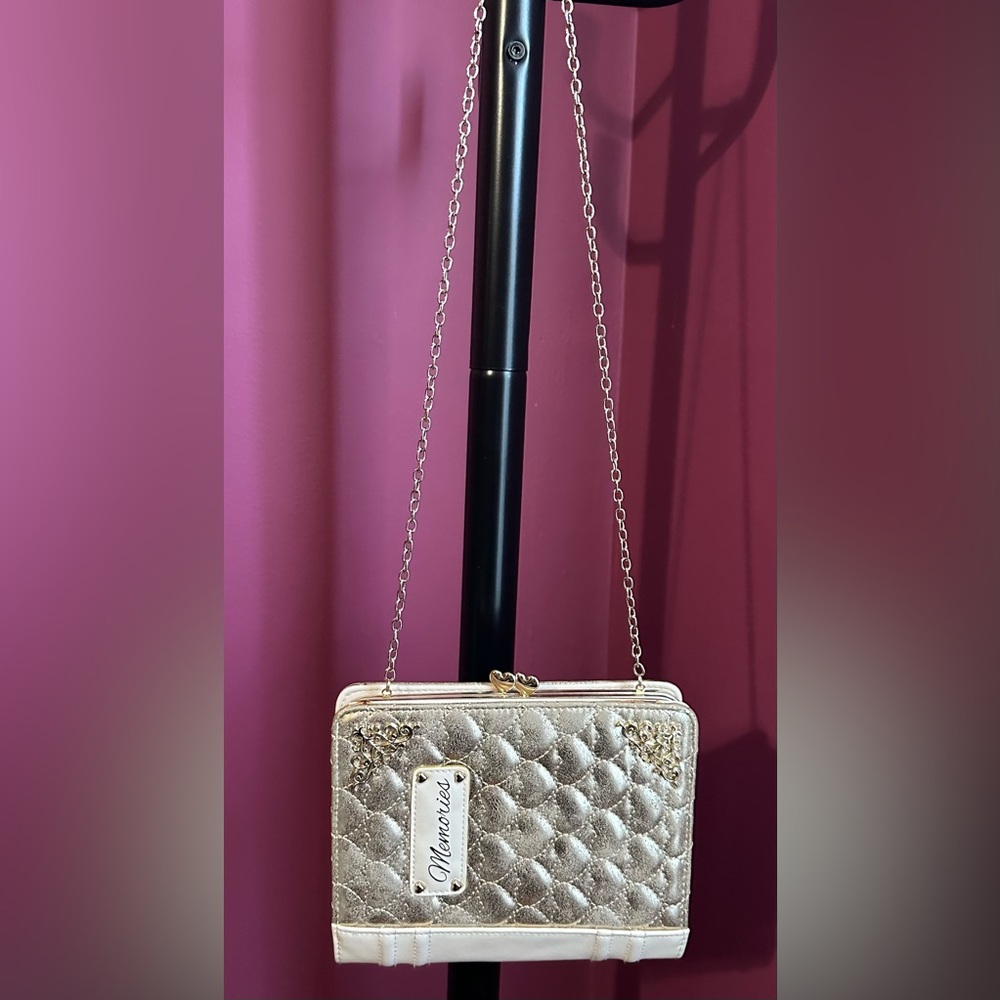 Claire’s gold quilted purse with a "Memories" label